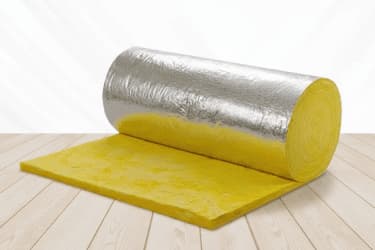 Fiberglass batt insulation installed in a metal building wall cavity